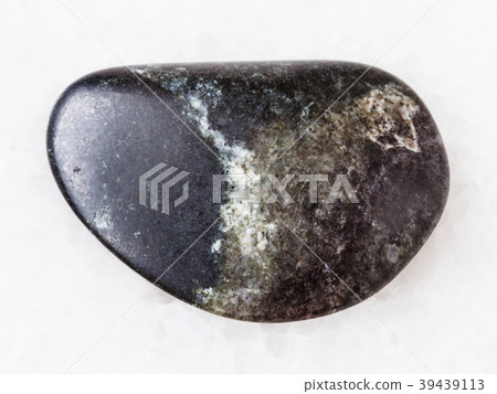 tumbled olivinite stone on white tumbled olivinite stone on white 39439113