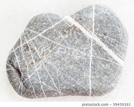 Greywacke sandstone on white Greywacke sandstone on white 39439161