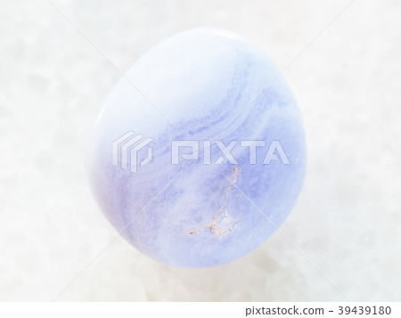 polished blue chalcedony gemstone on white marble 39439180