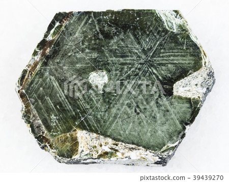 Phlogopite mica stone on white marble 39439270