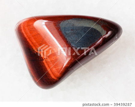 tumbled Ox's eye gemstone on white 39439287