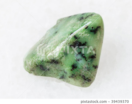 green Grossular garnet gemstone on white 39439370
