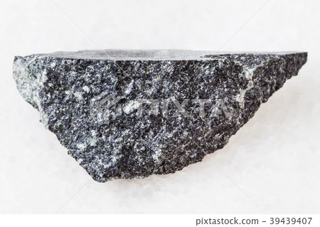 piece of dolerite (diabase) stone on white 39439407