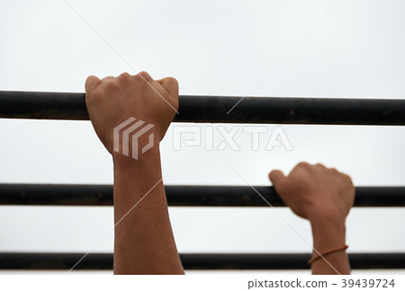 Obstacles race runners,hands overcome obstacle Obstacles race runners,hands overcome obstacle 39439724