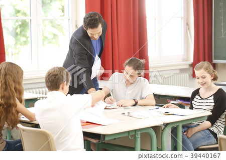 Teacher teaching or educate at the board a class 39440167