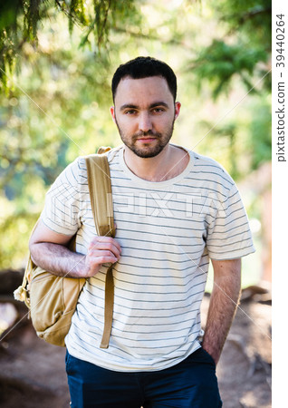 Smiling happy handsome man with beard in forest 39440264