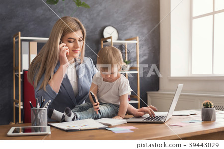 Young mother talking on phone and spending time 39443029