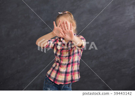 Little girl saying no, showing stop sign Little girl saying no, showing stop sign 39443142