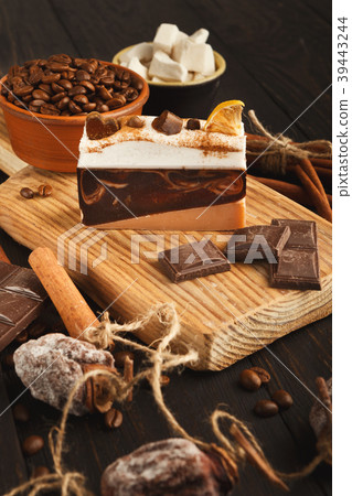 Various sweet treats: cakes and chocolate bars on Various sweet treats: cakes and chocolate bars on 39443244