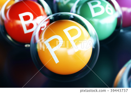 Vitamin PP, on black background. Symbol of health 39443737