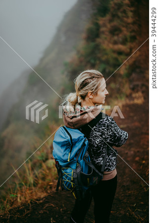 Close up of woman hiker with blue backpack on the 39444299