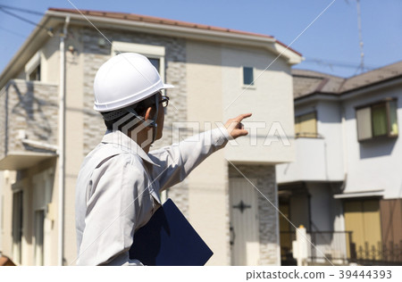 Housing and helmet men field work pointing Housing and helmet men field work pointing 39444393