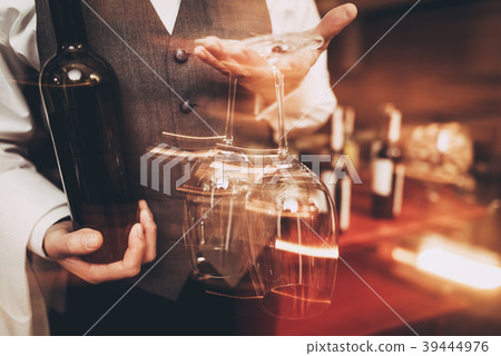 Sommelier holding with bottle of wine  39444976