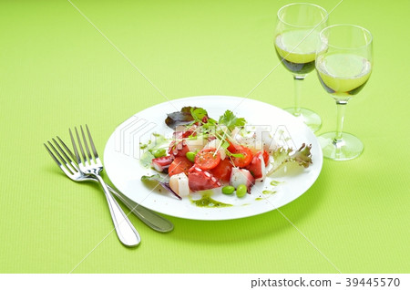 Marinated octopus and scallops with basil sauce. Italian-style appetizer, hors d'oeuvres. With white wine. 39445570