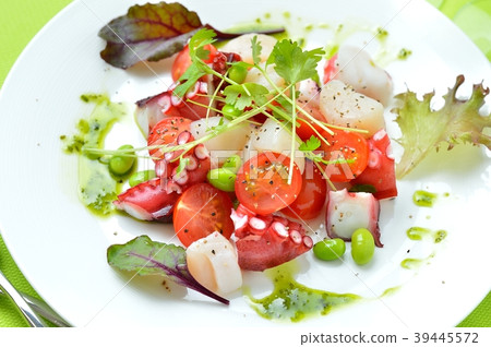 Marinated octopus and scallops with basil sauce. Italian-style appetizer, hors d'oeuvres. With white wine. 39445572
