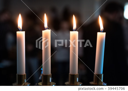 Four candles in dark place Four candles in dark place 39445706