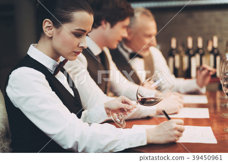 Female sommelier tasting red wine Female sommelier tasting red wine 39450961