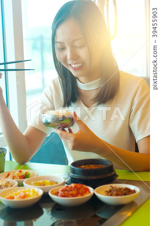 beautiful young asian girl eating korean food beautiful young asian girl eating korean food 39455903