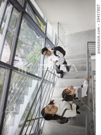 students are walking on stair and smilling 39457807