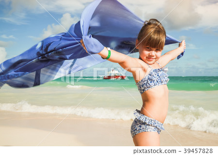 Little blond Caucasian girl with blue shawl 39457828