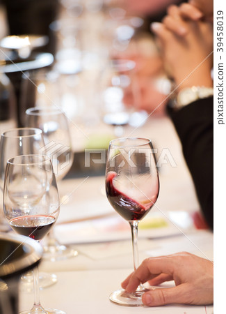 Senior Man Holding Glass of Red Wine Senior Man Holding Glass of Red Wine 39458019