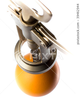 the corkscrew is screwed into the egg close-up the corkscrew is screwed into the egg close-up 39462944