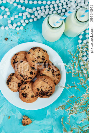 Cookie chocolate with a milk bottles.  39464842