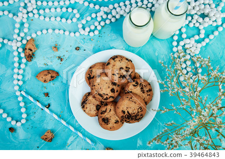Cookie chocolate with a milk bottles.  39464843