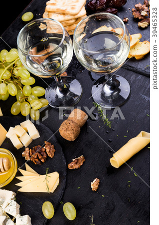 Cheese plate. Assortment of cheese with walnuts 39465328