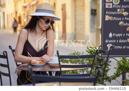 Woman waiting for someone at restaurant 39466220
