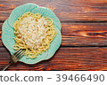 Seafood pasta mediterranean dish on wooden table 39466490