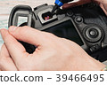 Digital camera dust cleaning service concept 39466495