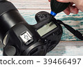 Cleaning professional digital camera body concept 39466497