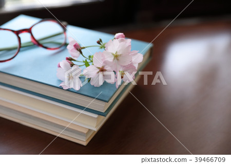 Books and cherry blossoms 39466709