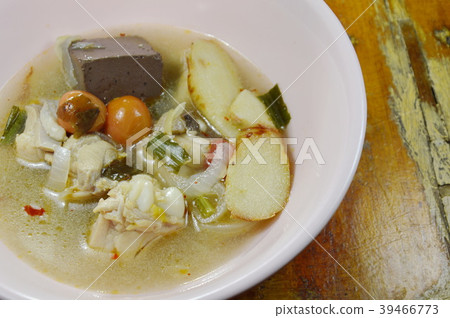 boiled chicken in hot and spicy tom yum soup  39466773