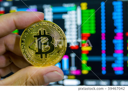 Man's hand holding Golden Bitcoin Man's hand holding Golden Bitcoin 39467042