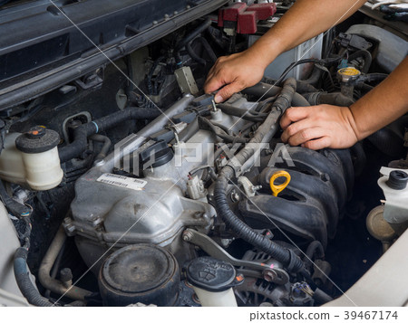 Car mechanic working in auto repair service Car mechanic working in auto repair service 39467174