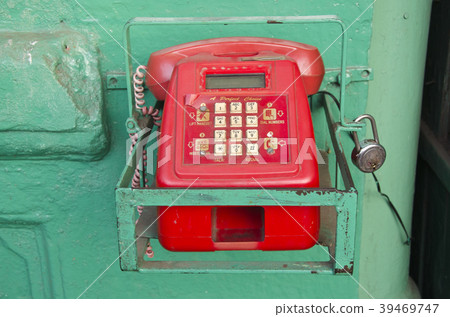 retro red telephone in asia street, India retro red telephone in asia street, India 39469747