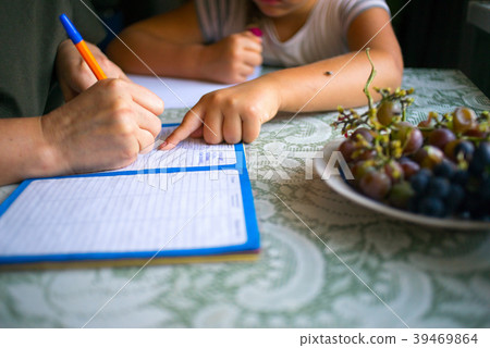 Studing human writing writing in a notebook 39469864
