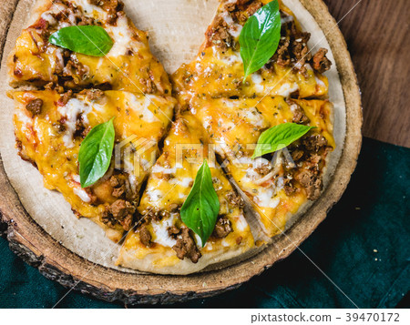 fresh baked pizza with meat cheese and Basil leaf fresh baked pizza with meat cheese and Basil leaf 39470172