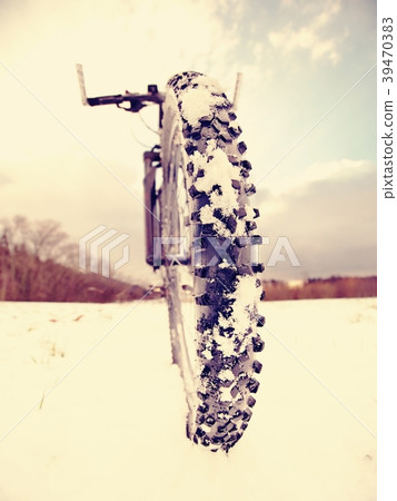 Front wheel of mountain bike while snow riding. Front wheel of mountain bike while snow riding. 39470383