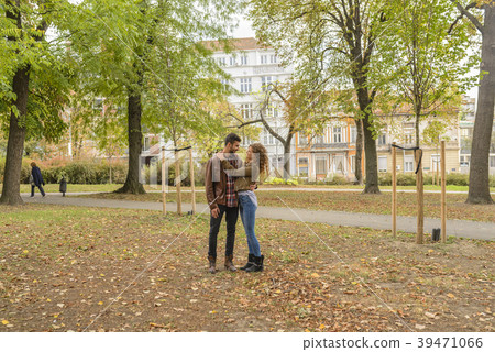 Young couple enjoying the time in the city park Young couple enjoying the time in the city park 39471066