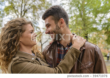 Young couple showing love in the city park Young couple showing love in the city park 39471078