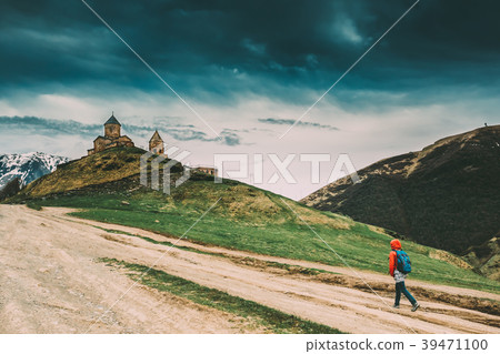 Stepantsminda, Gergeti, Georgia. Woman Walking 39471100