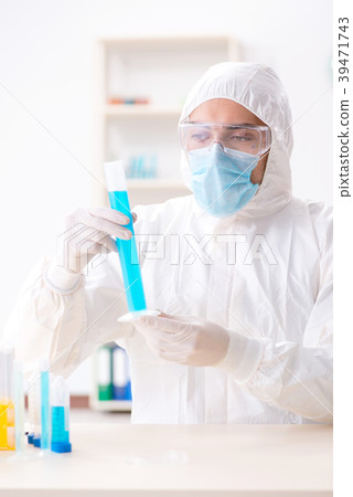 Young chemist student working in lab on chemicals Young chemist student working in lab on chemicals 39471743