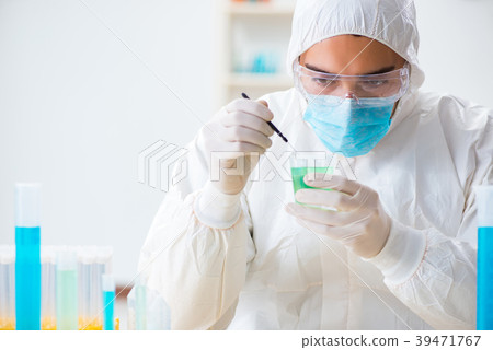 Young chemist student working in lab on chemicals 39471767
