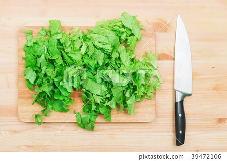 Close-up on a wooden table is a wooden cutting 39472106