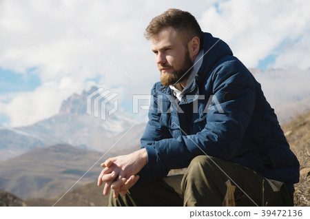 A portrait of a stylish smirk bearded hipster 39472136
