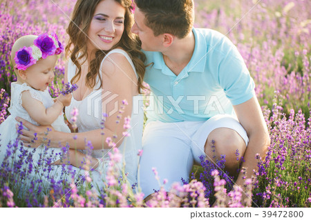 Young family in a lavender field Young family in a lavender field 39472800