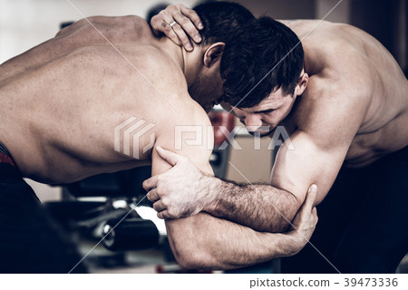 Two fit topless men wrestling Two fit topless men wrestling 39473336